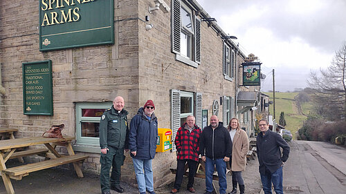 Gareth Farnan-Jones, Robert Cragg and Rob Knotts – Scouthead And Austerlands Community Group; Mick Wilkin, Landlord of the Spinners Arms; and Councillors Alicia Marland and Garth Harkness